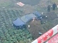 玛莎拉蒂掉落坟前