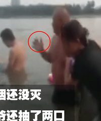 大叔叼着烟下水救人 把人救上岸后烟还没灭